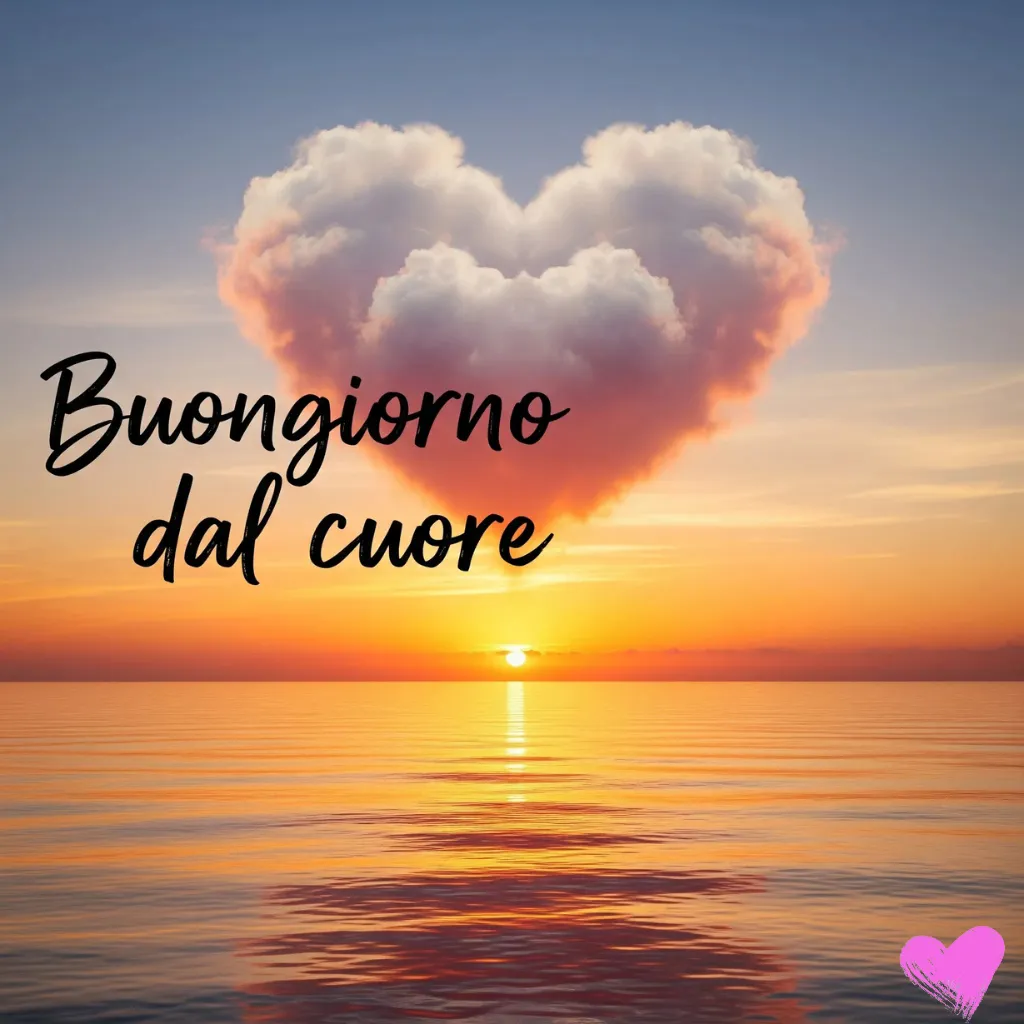 Una nuvola a forma di cuore si staglia nel cielo sopra un mare calmo al tramonto. Le parole "Buongiorno dal cuore" sono scritte in corsivo in basso all'immagine.